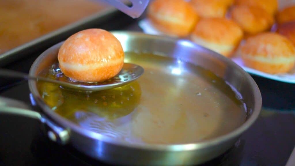frying donuts for creme brulee donuts