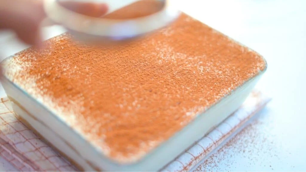 dust the tiramisu with cocoa powder