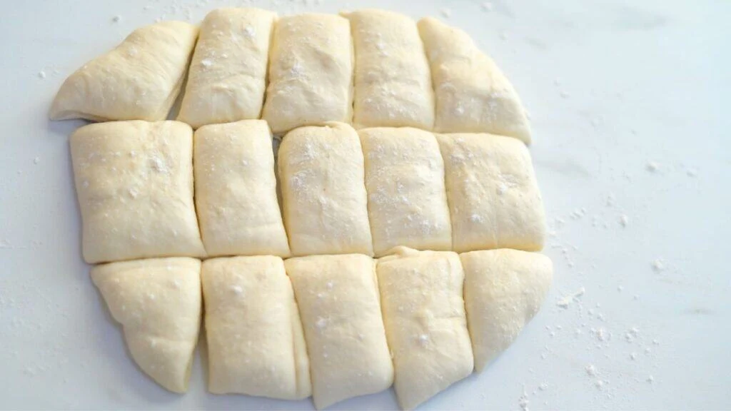 shaping sourdough dinner rolls