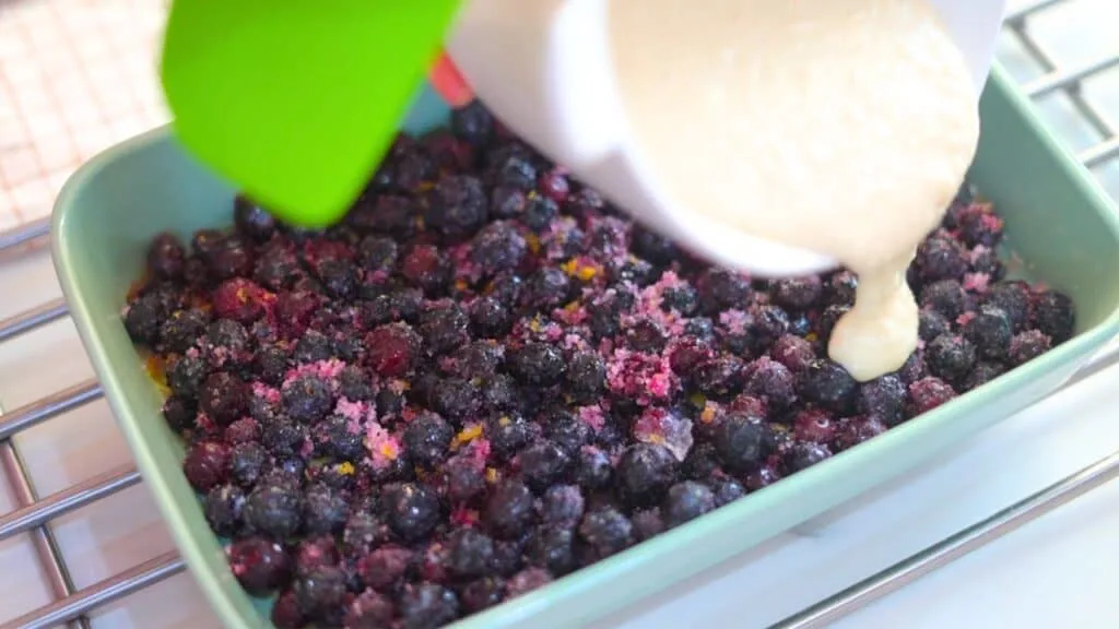 making blueberry cobbler