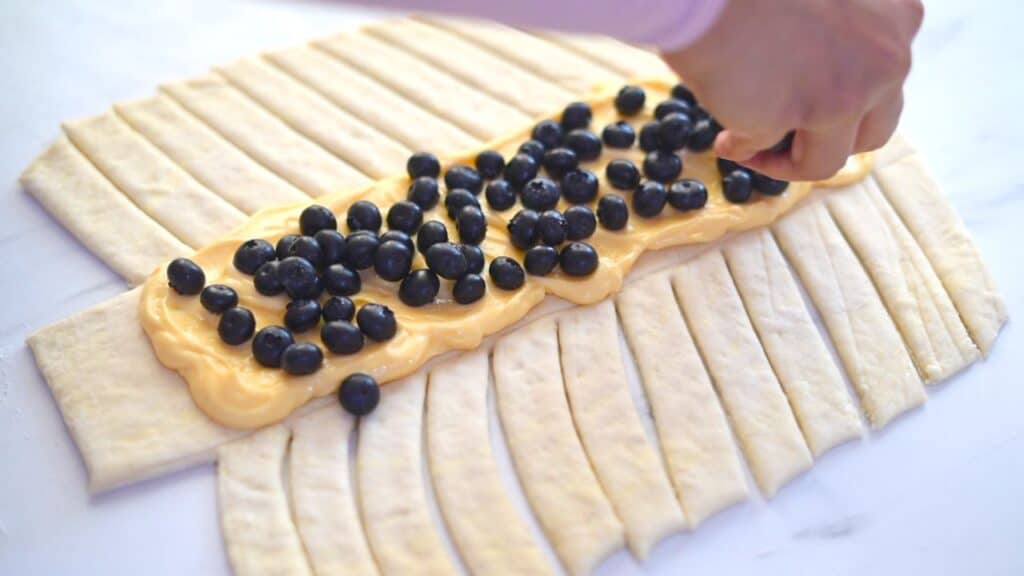 filling blueberries for braided Danish pastry